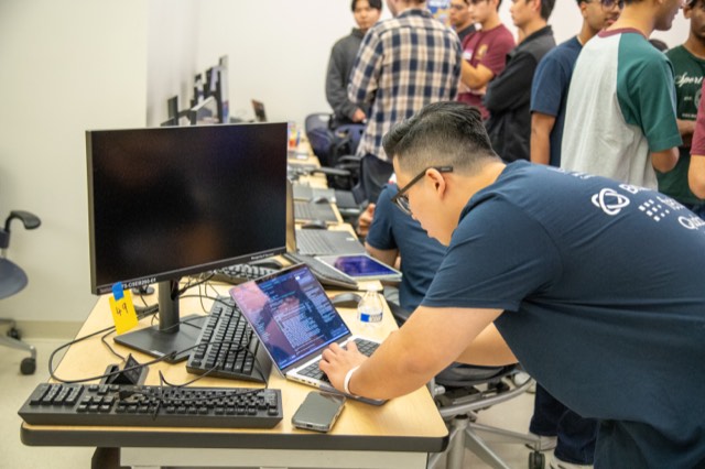Phu Quach at a hackathon — building, competing, and networking